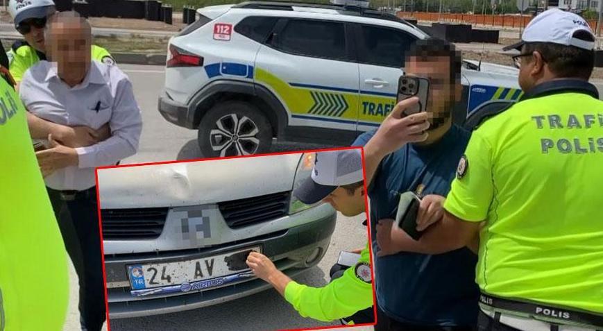 Plakasını bantla kapatan baba ve oğlu polis ablukaya aldı! Şoke eden savunma
