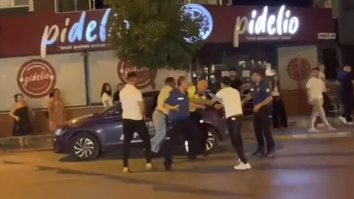 İzmir’de ceza yazan polise saldırdılar: O anlar cep telefonu kamerasında