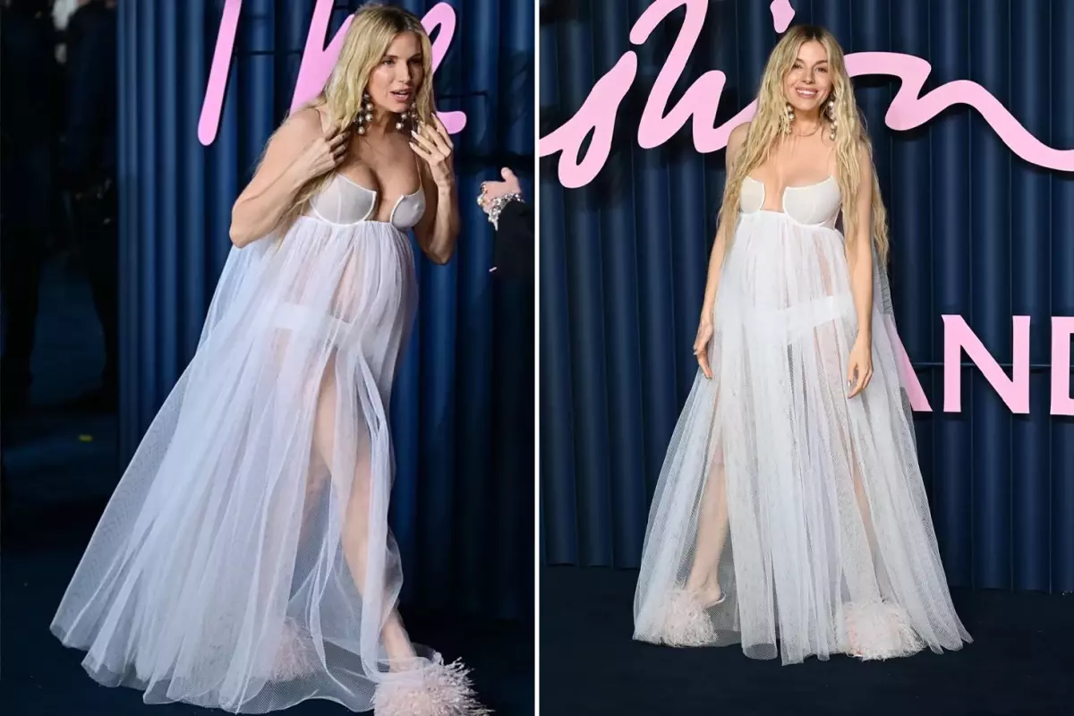 Ünlü oyuncu hamileliğini tül elbisesiyle kırmızı halıda duyurdu